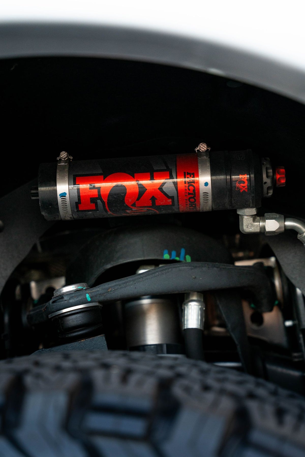 Fox remote reservoir shock installed above an off-road tire