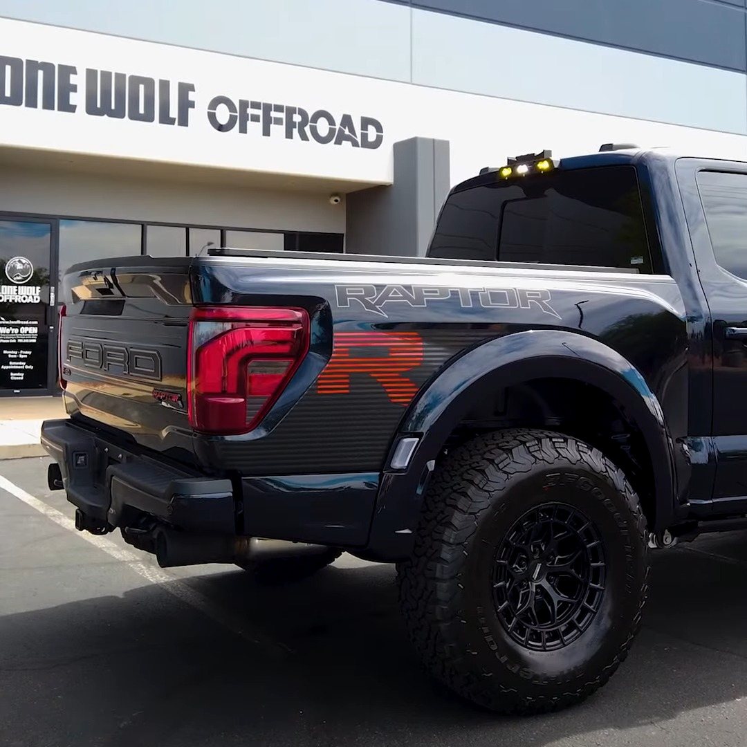 Black Ford Raptor R on aftermarket wheels parked outside the Lone Wolf Off Road shop in Henderson, Nevada