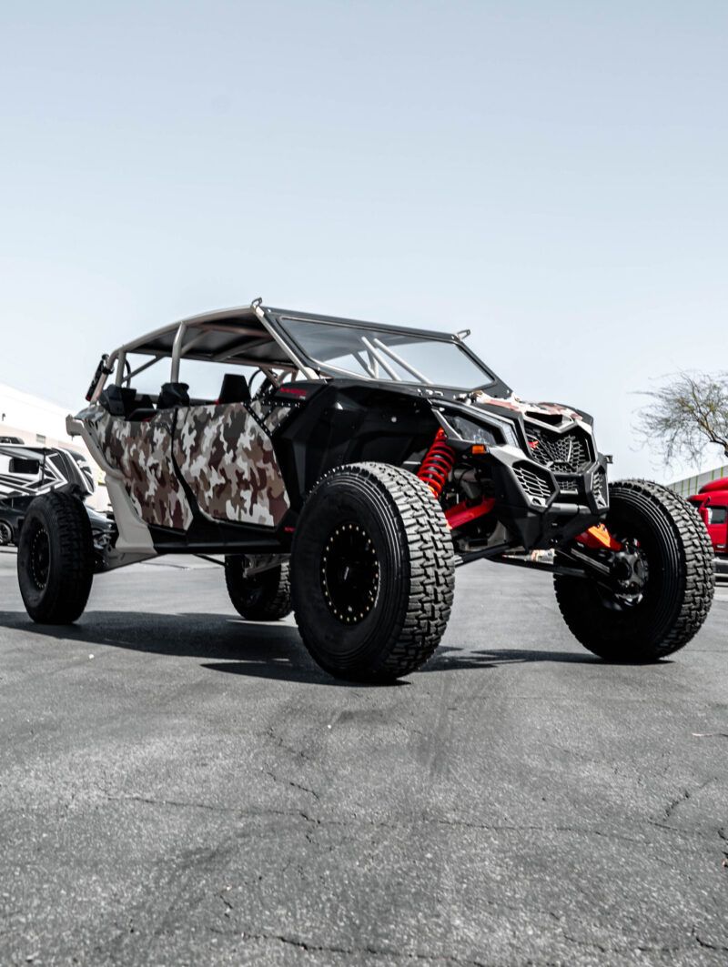 Camo-wrapped UTV on all-terrain tires